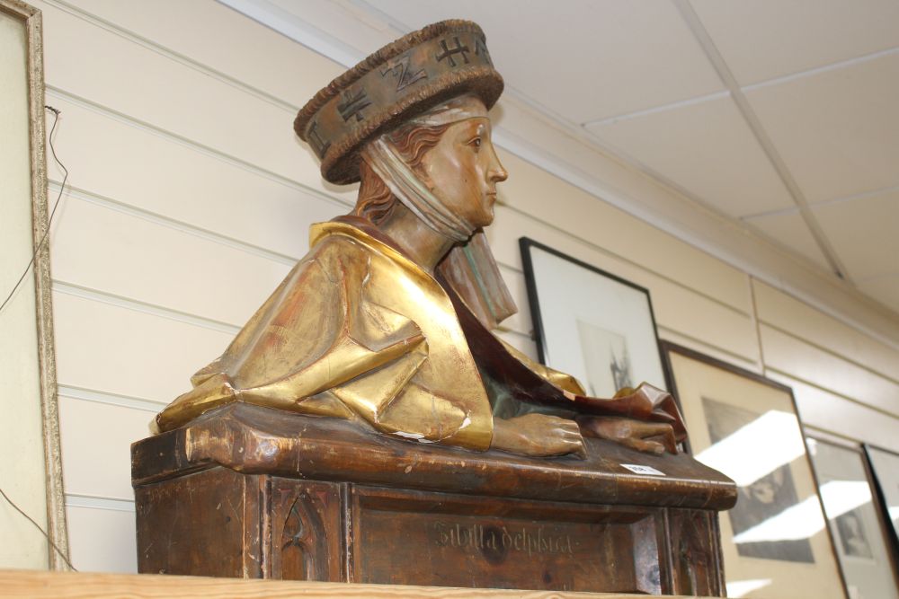 A late 19th century Black Forest carved gilt and stained pine bust of Sibilla Delphica, height 62cm width 70cm